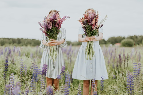 Two girls holding bouquets Stock Photo