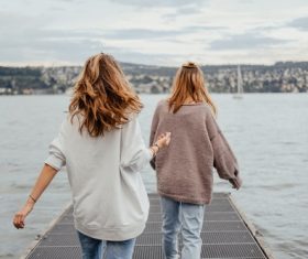 Two girls watching the sea Stock Photo