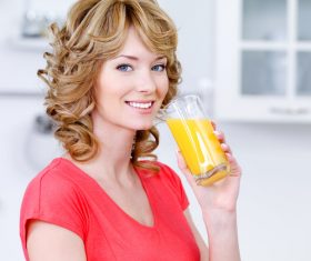 Woman drinking juice Stock Photo