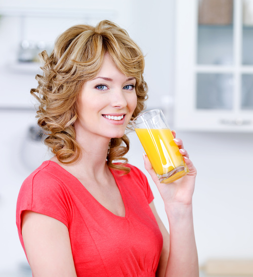 Woman drinking juice Stock Photo