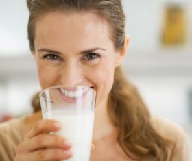 Woman drinking milk Stock Photo 01