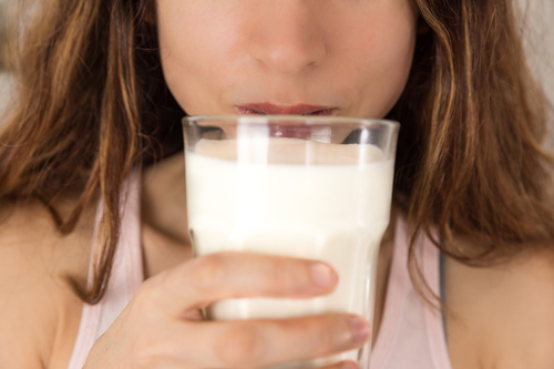 Woman drinking milk Stock Photo 03