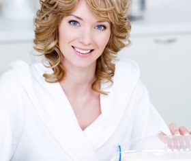 Woman eating instant cereal Stock Photo