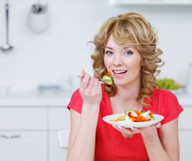 Woman eating vegetable salad Stock Photo 03