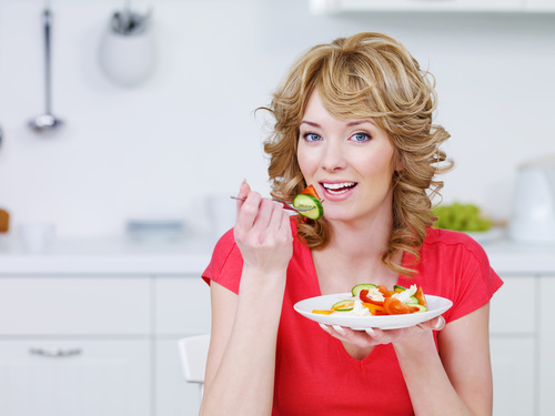 Woman eating vegetable salad Stock Photo 03
