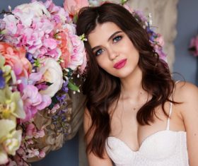 Woman model by flowers Stock Photo