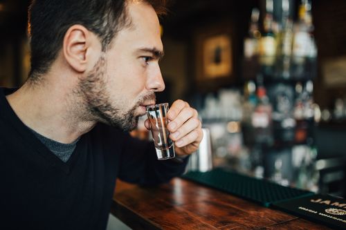 Young man drinking at the bar Stock Photo 01