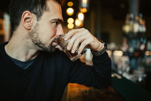 Young man drinking at the bar Stock Photo 02