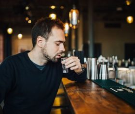 Young man drinking at the bar Stock Photo 03