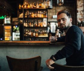 Young man drinking at the bar Stock Photo 04