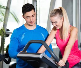 men and women in the gym Stock Photo