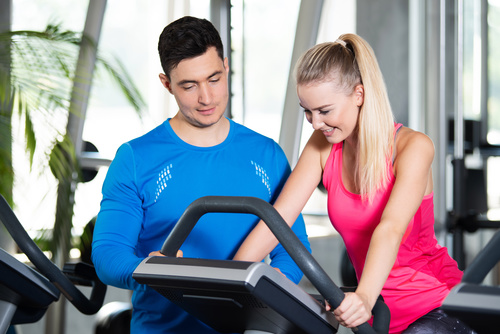 men and women in the gym Stock Photo