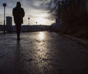 night is coming people walking on the city road Stock Photo