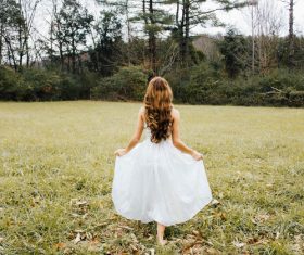woman in white dress outdoors Stock Photo