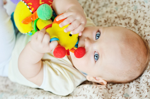 Baby biting a toy Stock Photo 02