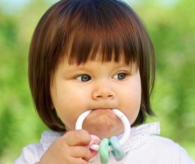 Baby biting a toy Stock Photo 04