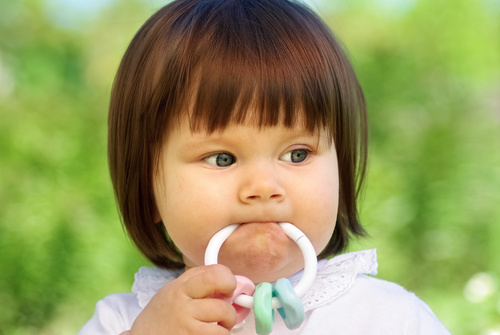 Baby biting a toy Stock Photo 04