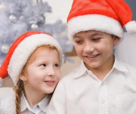Child wearing christmas hat Stock Photo 01