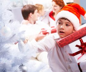 Child wearing christmas hat Stock Photo 03