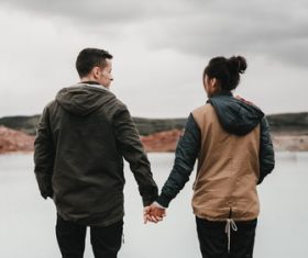 Couple holding hands back shadow Stock Photo