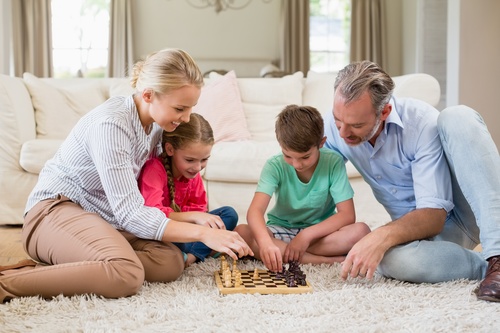 Family playing Chess Stock Photo