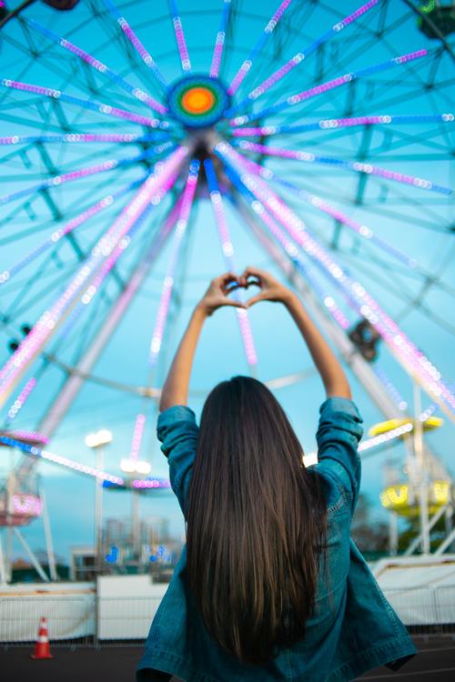 Ferris wheel long hair beauty back shadow Stock Photo