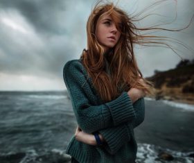 Girl blowing the sea breeze Stock Photo