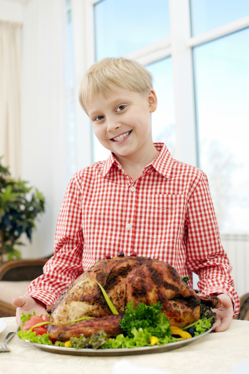 Little boy and festive sultry turkey Stock Photo