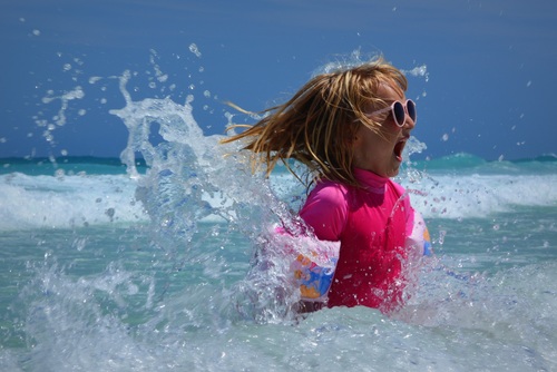 Little girl having fun in the sea water Stock Photo