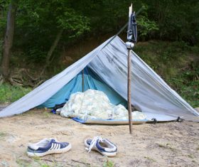 Man sleeping in camping tent Stock Photo