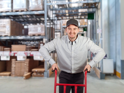 Man working in logistics warehouse Stock Photo