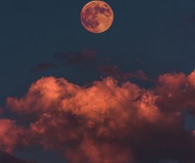 Reddish dusk moon Stock Photo