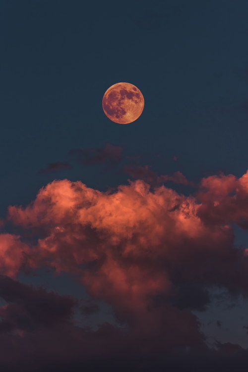 Reddish dusk moon Stock Photo