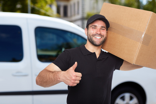 Smiling young delivery guy Stock Photo 03