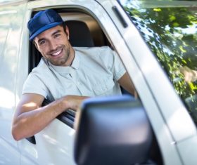 Smiling young delivery guy Stock Photo 07