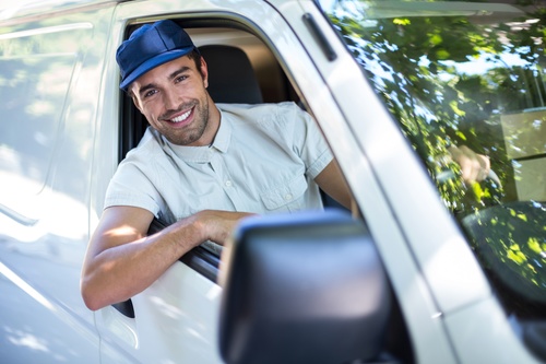 Smiling young delivery guy Stock Photo 07