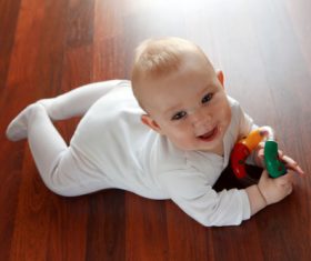 Stock Photo Baby holding rattle to play 02