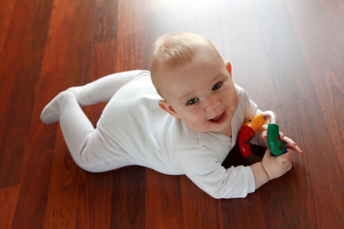 Stock Photo Baby holding rattle to play 02