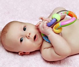 Stock Photo Baby holding rattle to play 03