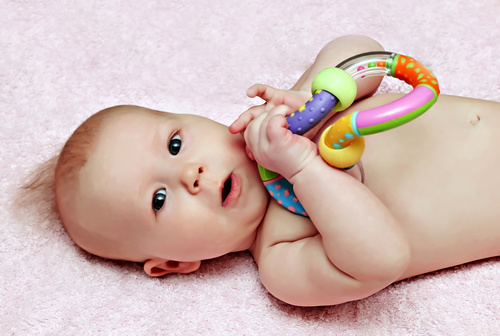 Stock Photo Baby holding rattle to play 03