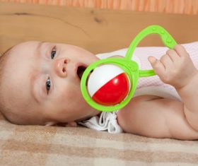 Stock Photo Baby holding rattle to play 05