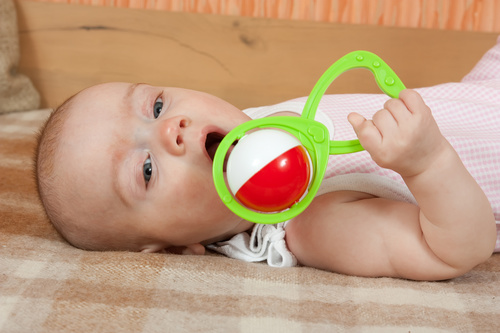 Stock Photo Baby holding rattle to play 05