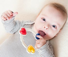 Stock Photo Baby holding rattle to play 06