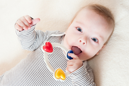 Stock Photo Baby holding rattle to play 06