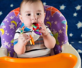 Stock Photo Baby holding rattle to play 07