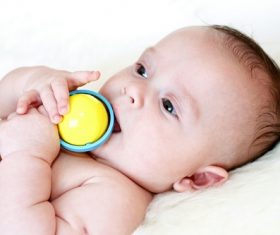 Stock Photo Baby holding rattle to play 08