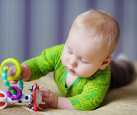 Stock Photo Baby holding rattle to play 10