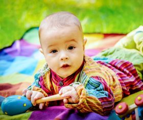 Stock Photo Baby holding rattle to play 11