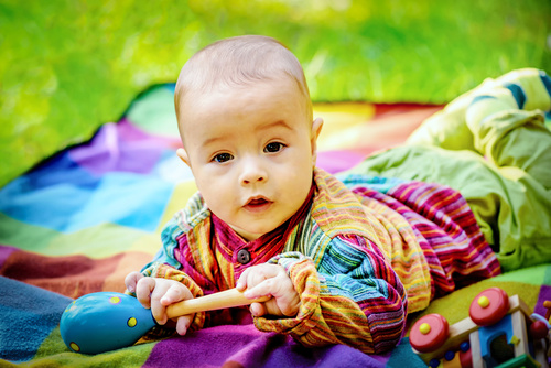 Stock Photo Baby holding rattle to play 11