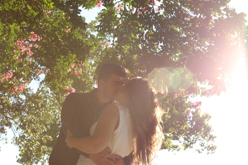Stock Photo Backlit shot kissing lovers